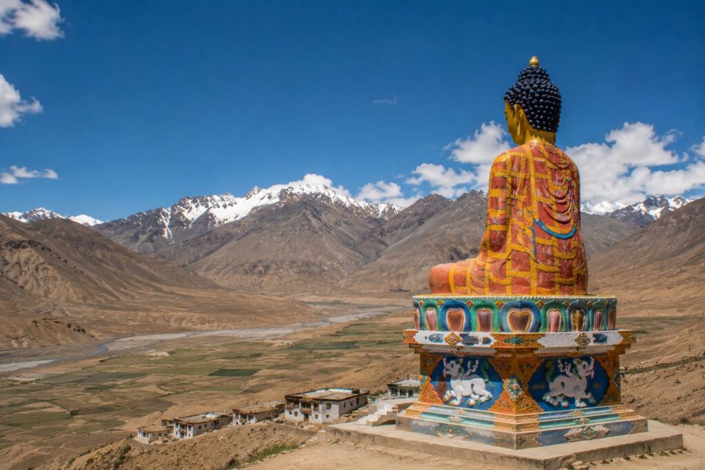 Giant Buddha statue in Langza village with Spiti Valley backdrop
