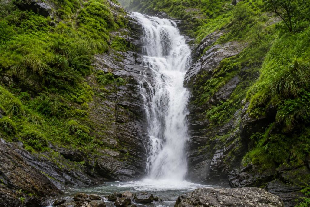 Bhagsunag Waterfall near McLeod Ganj Dharamshala flowing during monsoon July
